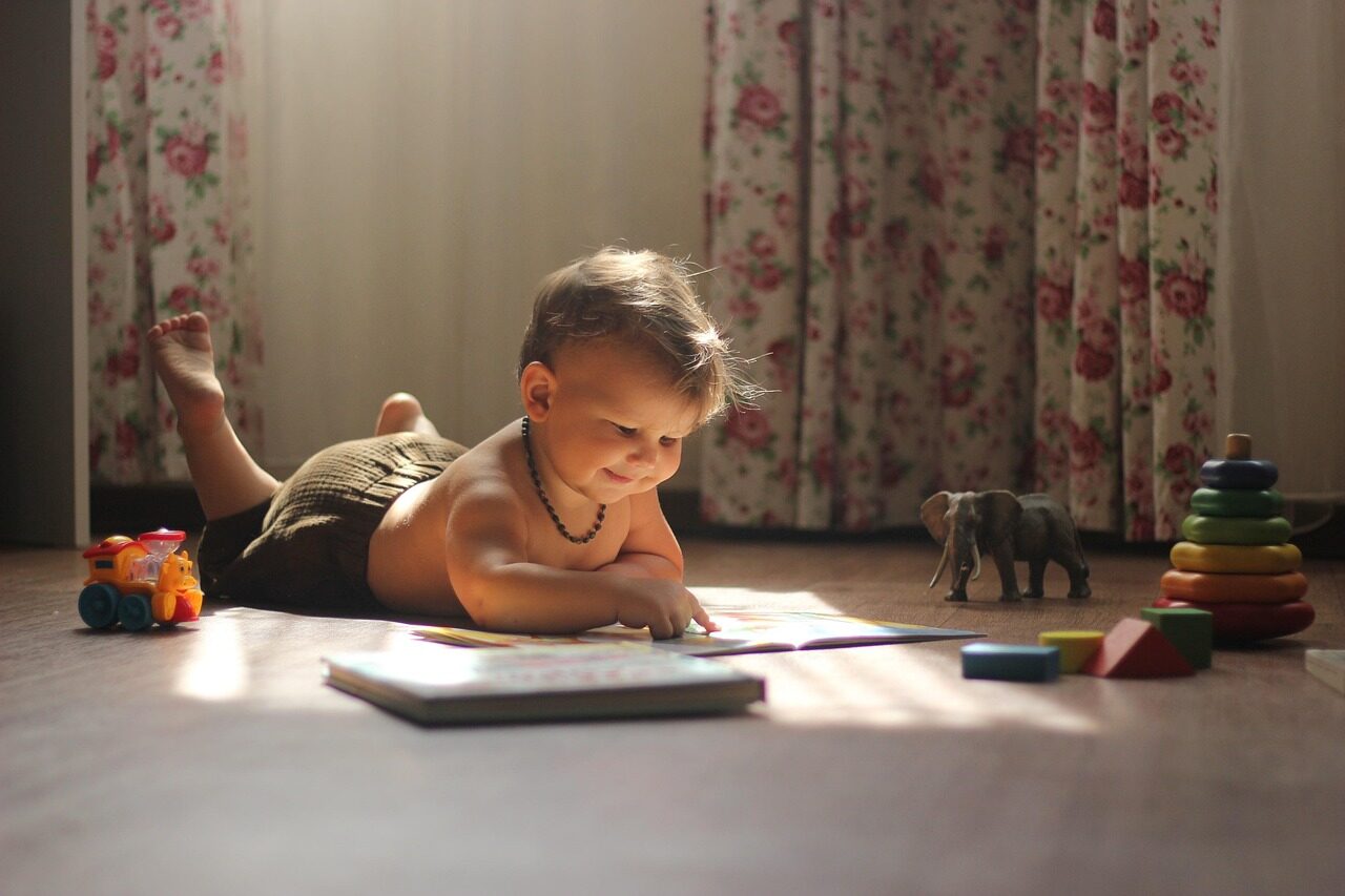 Photo by katerinakucherenko baby, read, play, reading, playing, toys, baby toys, toddler, infant, book, story book, portrait, baby portrait, baby boy, boy, kid, childhood, baby, baby, baby, baby, baby, reading, toys, book